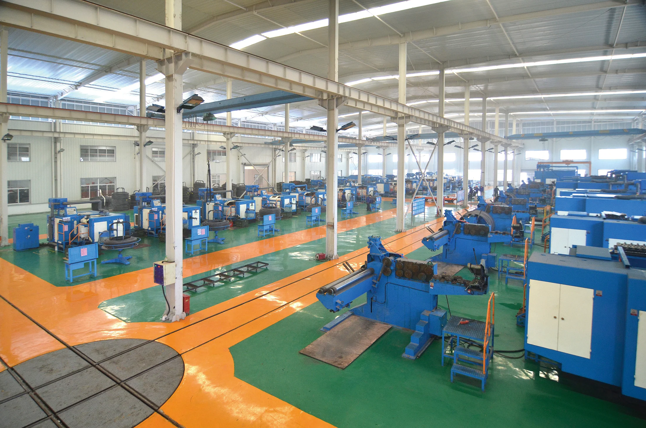 Interior of the automobile parts workshop with wire drawing and cold forming equipment