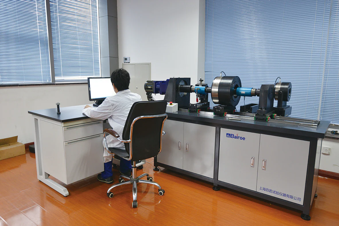 Technician operating testing equipment in the company laboratory